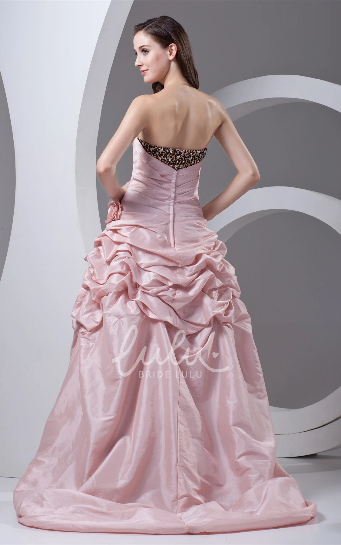 strapless high-low leopard gown with pick-up design and flower