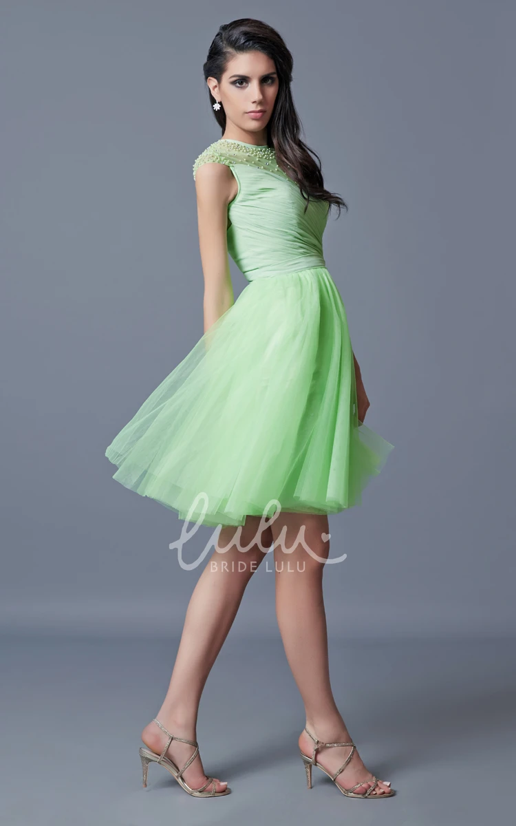 Short Tulle Homecoming Dress with Cap Sleeves Beading and Pleats Unique and Flowy