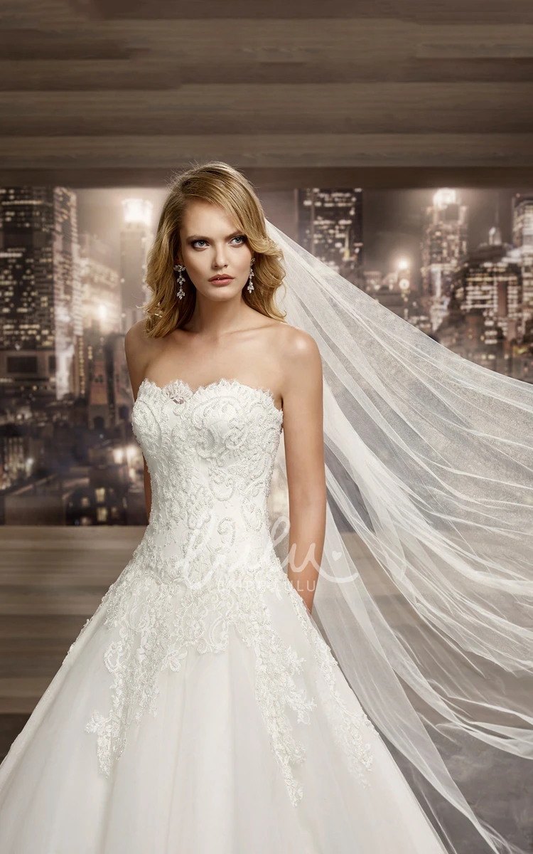 A-line Lace Bridal Gown with Strapless Neckline Brush Train Appliques Lace-Up Back
