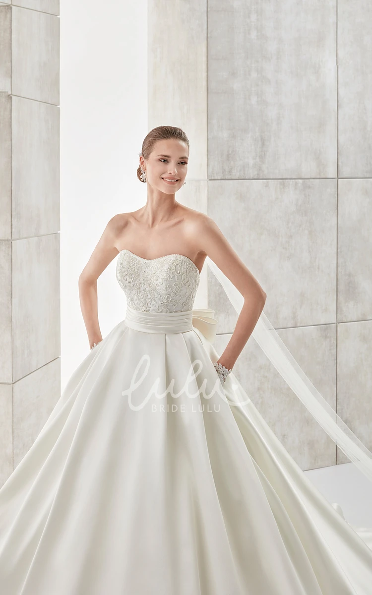 A-line Wedding Dress with Strapless Neckline Cinched Waistband and Back Bow