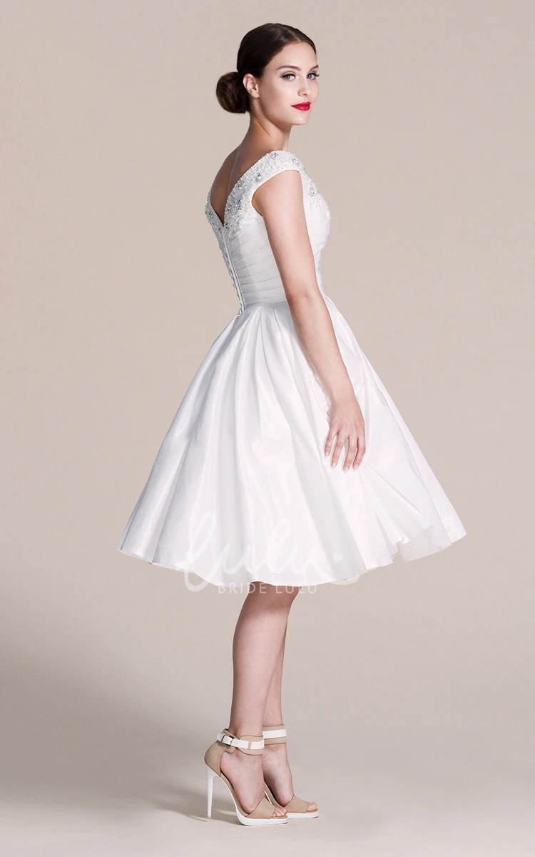 Cap-sleeved A-line Wedding Dress With Pleats and Beadings V-neck