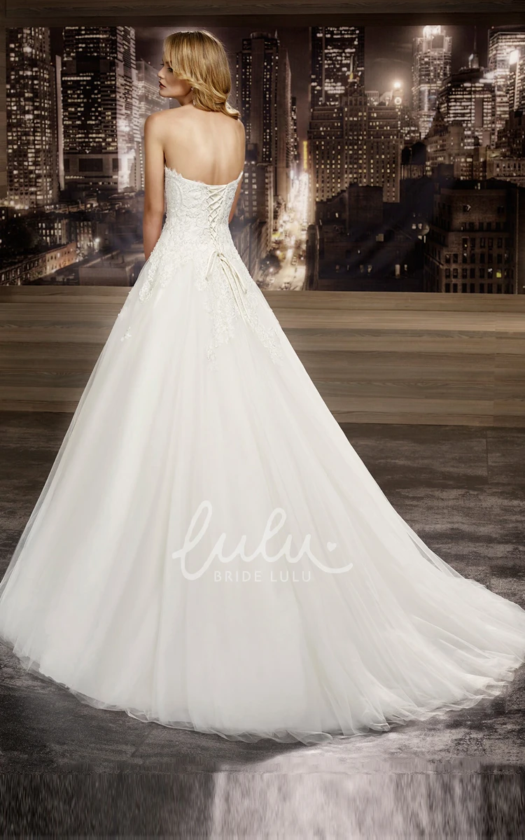 A-line Lace Bridal Gown with Strapless Neckline Brush Train Appliques Lace-Up Back
