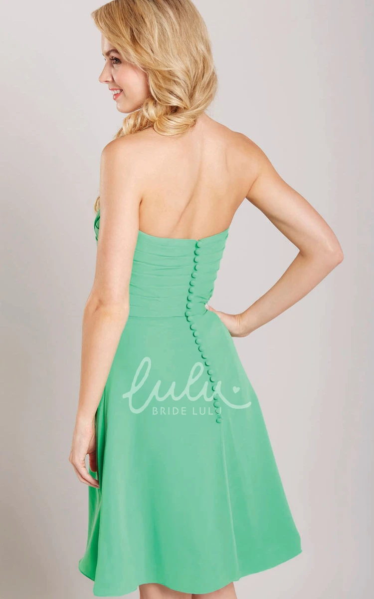 Knee-Length Strapless Chiffon Bridesmaid Dress with Ruching and Flower Detail
